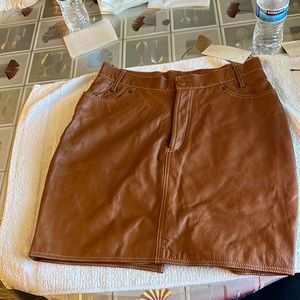 Leather cognac color really nice and  new with tags !